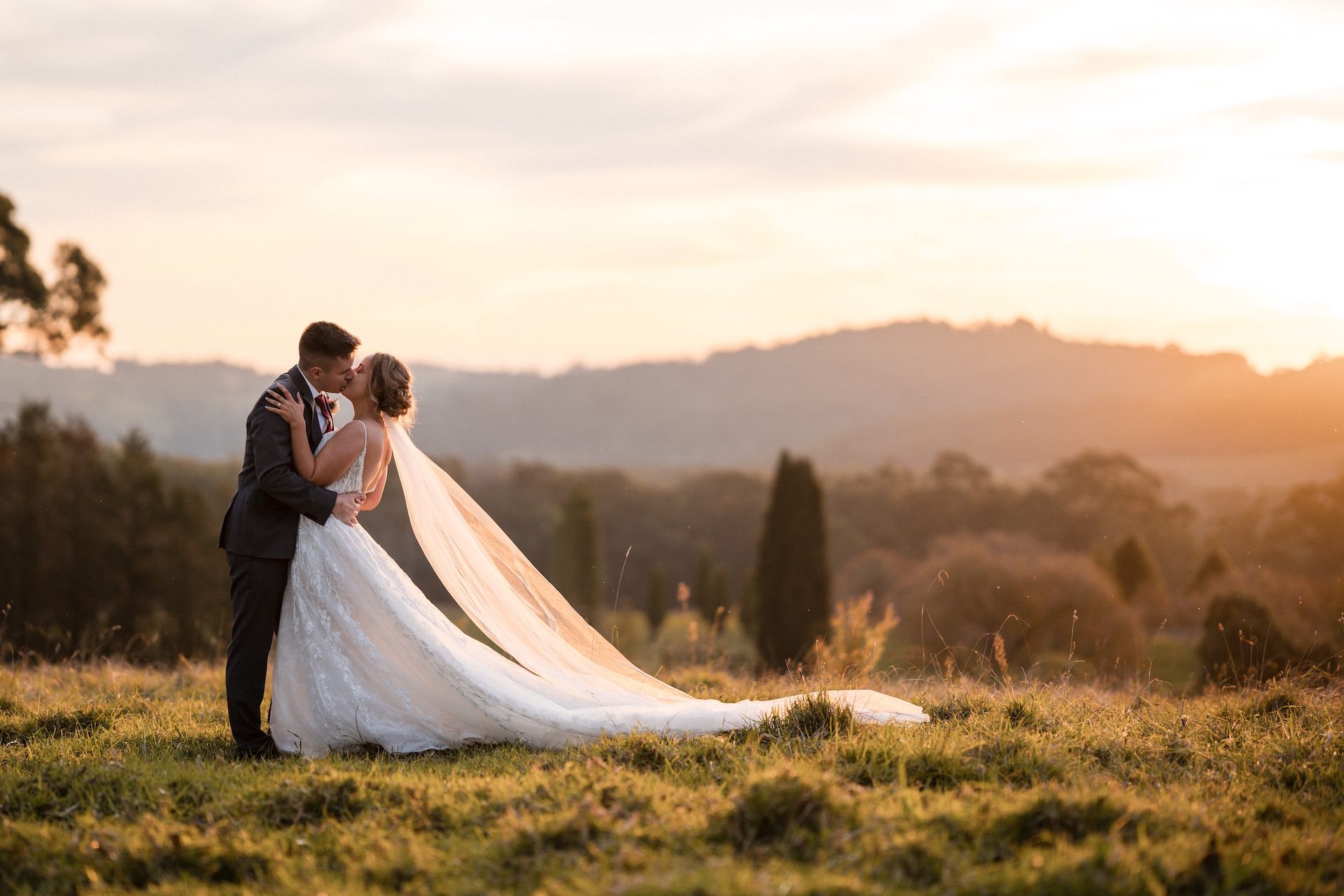 Newlyweds hugging and posing for a photo - raw footage wedding videography services in Sydney, Southern Highlands, Hunter Valley, Blue Mountains, etc. - Just Footage